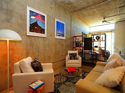 a living room with couches and chairs and a table